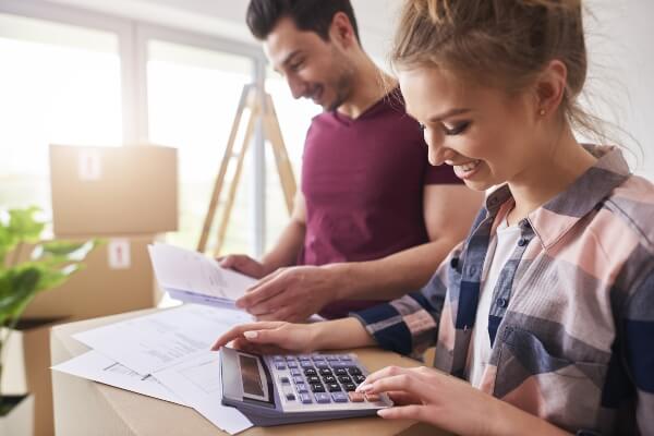 A couple works on their financing for a home renovation project.