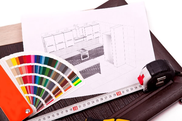 Design photos of a kitchen layout rests behind a color scheme wheel.