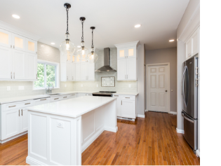 Image of kitchen with wood cabinets and stainless steel appliances